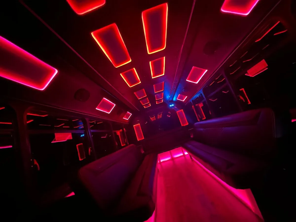 Ford E-450 Series Party Bus interior with LED accent lighting and LED ceiling lighting for party bus rental Ford E-450 Series Party Bus interior with LED accent lighting and LED ceiling lighting for party bus rental