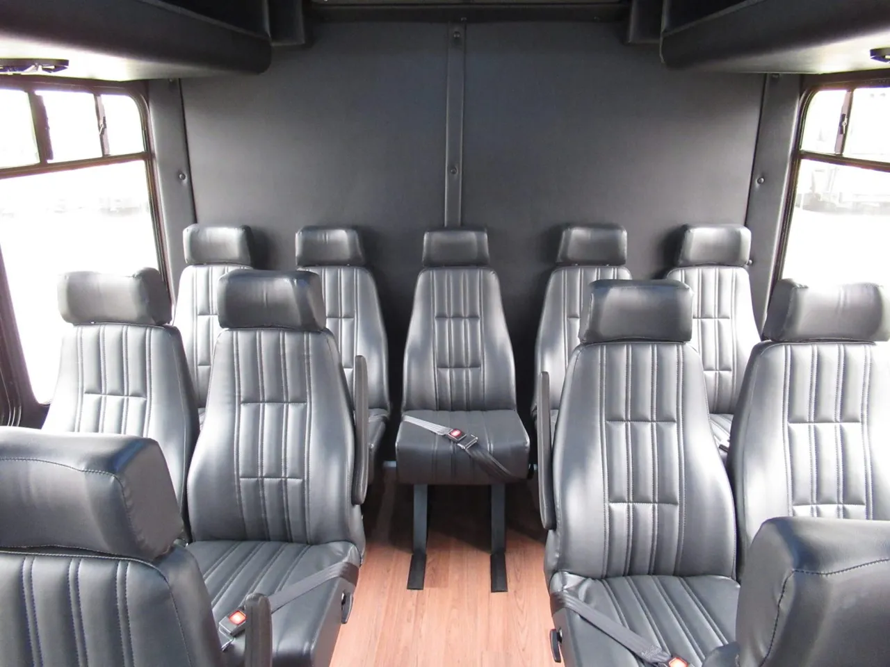 FORD F550 Executive VIP Mini Coach (28 Passenger) interior with wood-look flooring and passenger seat belts, photo 3 for winery tour transport in Washington