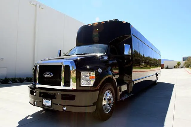 Black Ford F600 Executive VIP Shuttle Bus (32 Passengers), photo 3 for minibus rental in Hughes Springs, TX