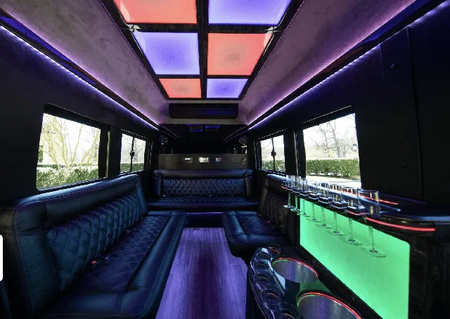 Ford Limousine Van interior with sofa-style seating, LED accent lighting and LED ceiling lighting for bachelorette party transport in Charlottesville, VA