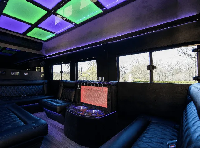 Ford Limousine Van interior with sofa-style seating, LED accent lighting and LED ceiling lighting, photo 2 for bachelorette party transport in Charlottesville, VA
