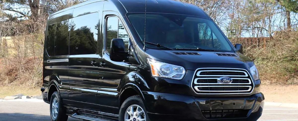 Black Ford Transit Shuttle BUS with tinted windows for winery tour transport in Rhode Island