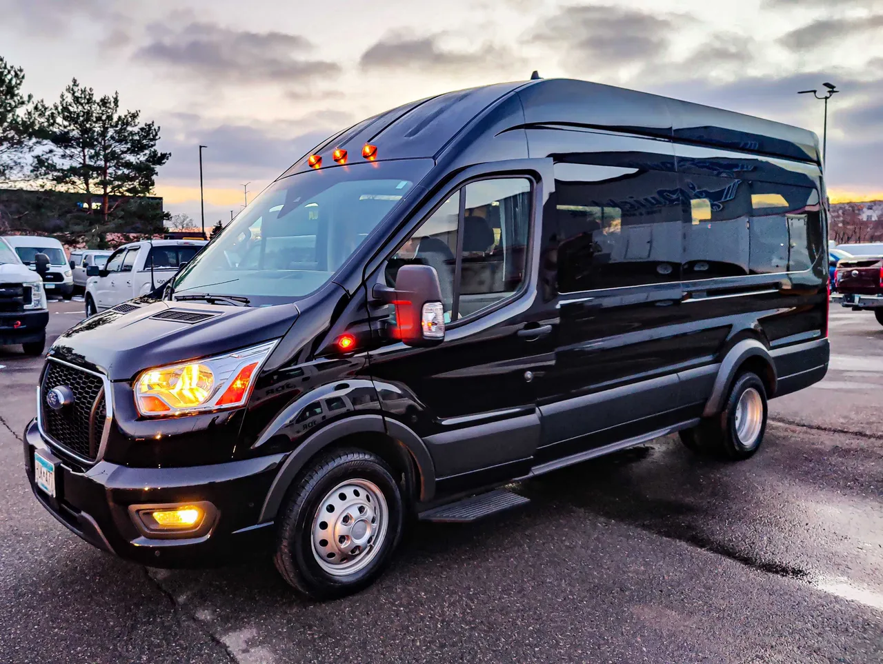 Black Ford Transit Sprinter for mini coach rental in North Bend, NE
