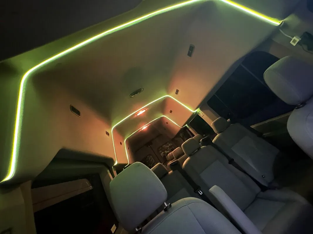 Ford Transit Van interior with high-roof cabin and LED ceiling lighting, photo 4 for minibus rental Ford Transit Van interior with high-roof cabin and LED ceiling lighting, photo 4 for minibus rental