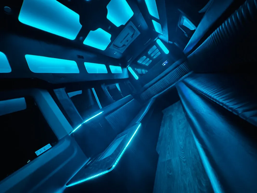 Ford Transit Van interior with perimeter lounge seating, LED accent lighting and LED ceiling lighting, photo 4 for party bus rental Ford Transit Van interior with perimeter lounge seating, LED accent lighting and LED ceiling lighting, photo 4 for party bus rental