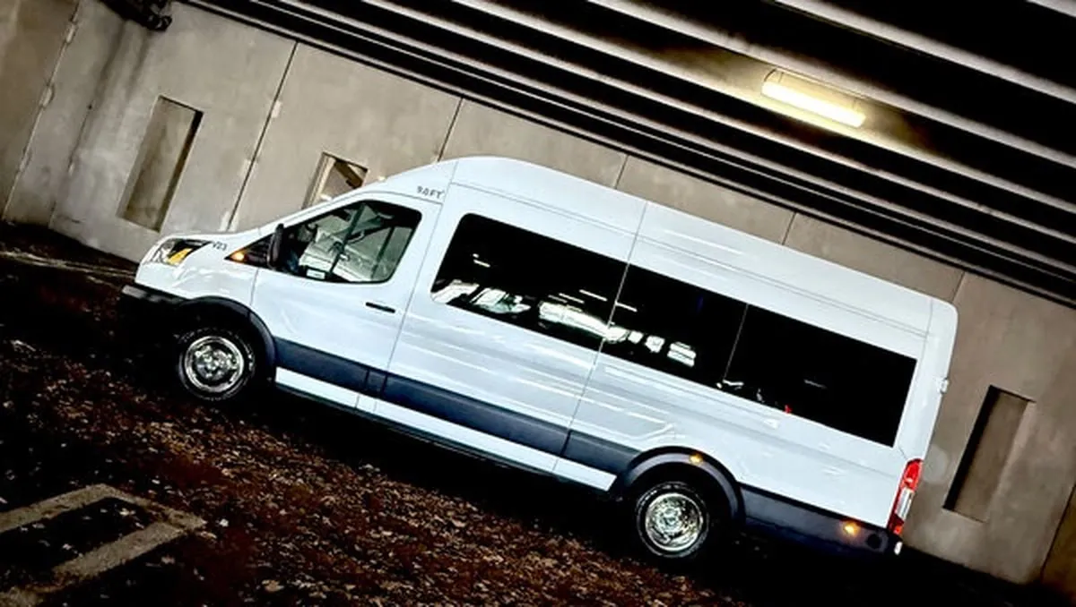 White Ford Transit VAN with tinted windows for mini coach rental in Medfield, MA