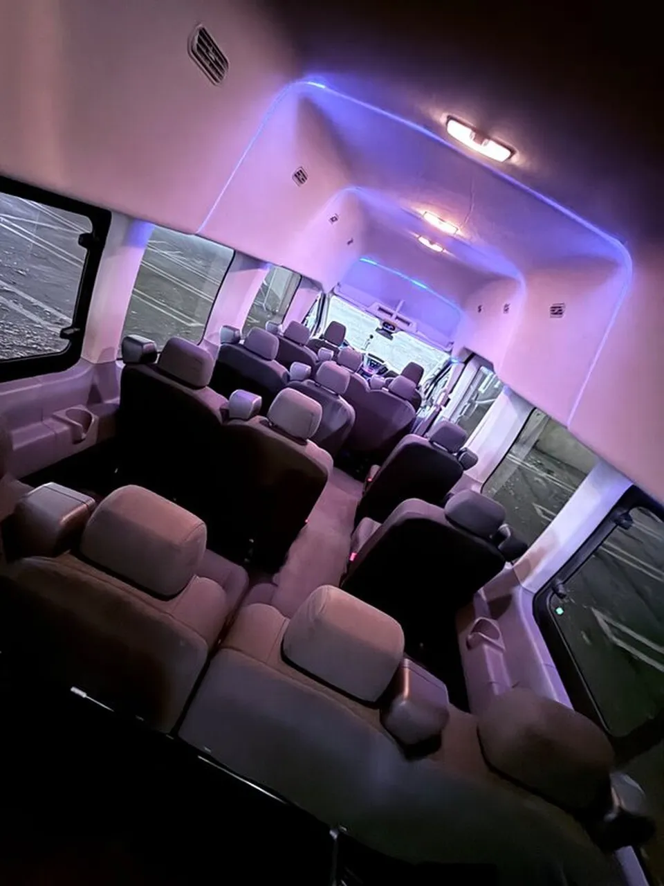 Ford Transit VAN interior with high-roof cabin and LED ceiling lighting for mini coach rental in Medfield, MA
