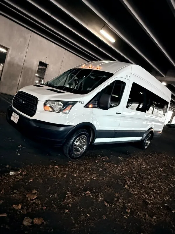 White Ford Transit VAN exterior with tinted windows, photo 5 for mini coach rental in Medfield, MA