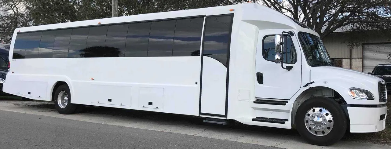 White Freightliner Luxury Coach for charter bus rental in Tylertown, MS