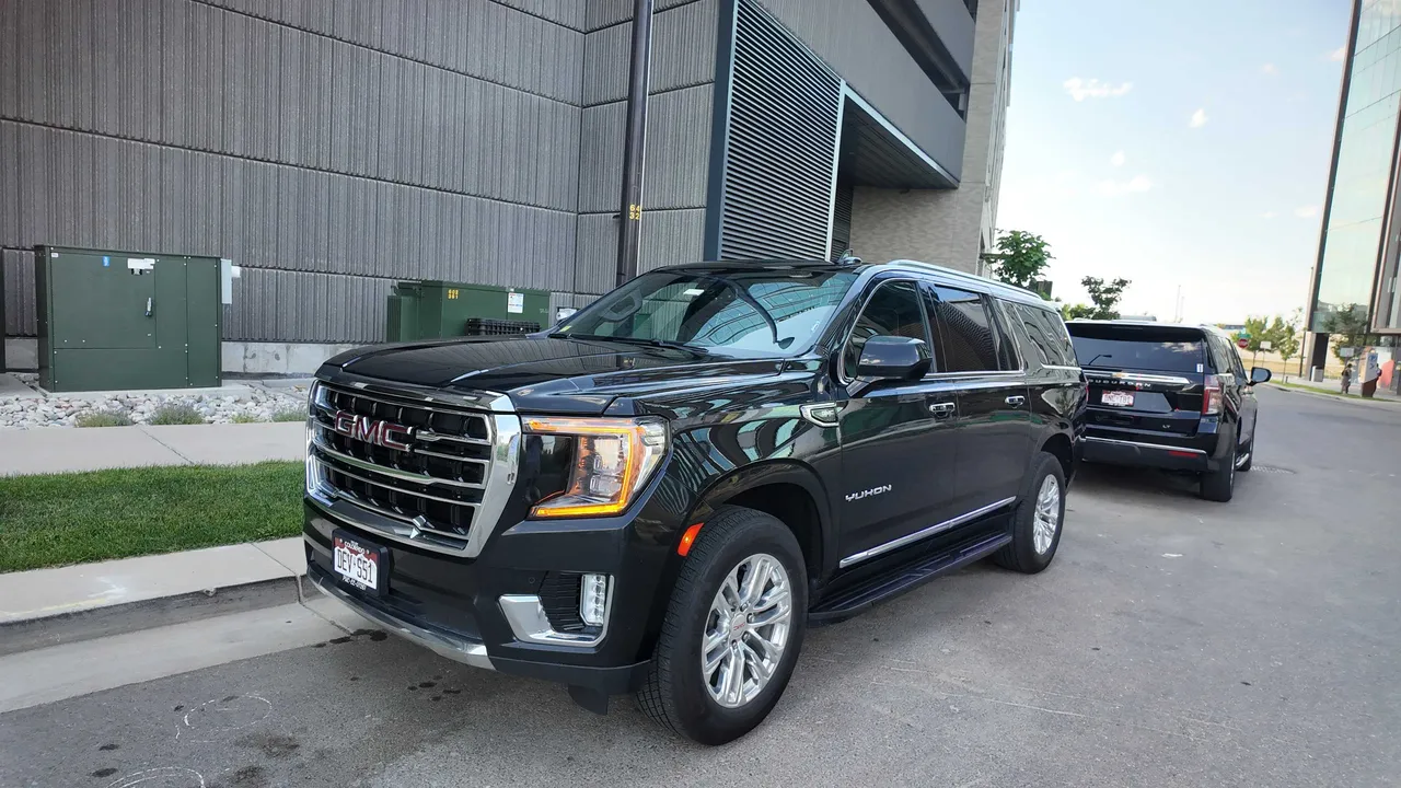 Black GMC Yukon with running boards for mercedes V-Class rental in Aurora, CO