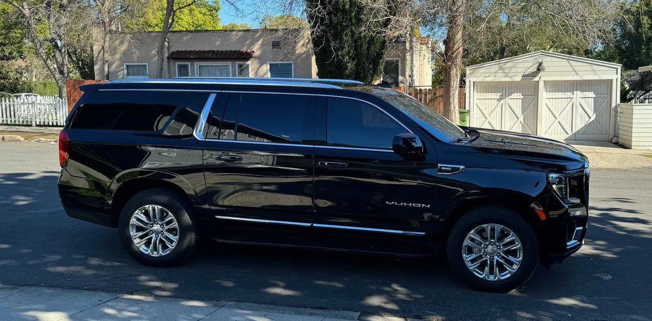 Black GMC Yukon XL exterior for airport transfers