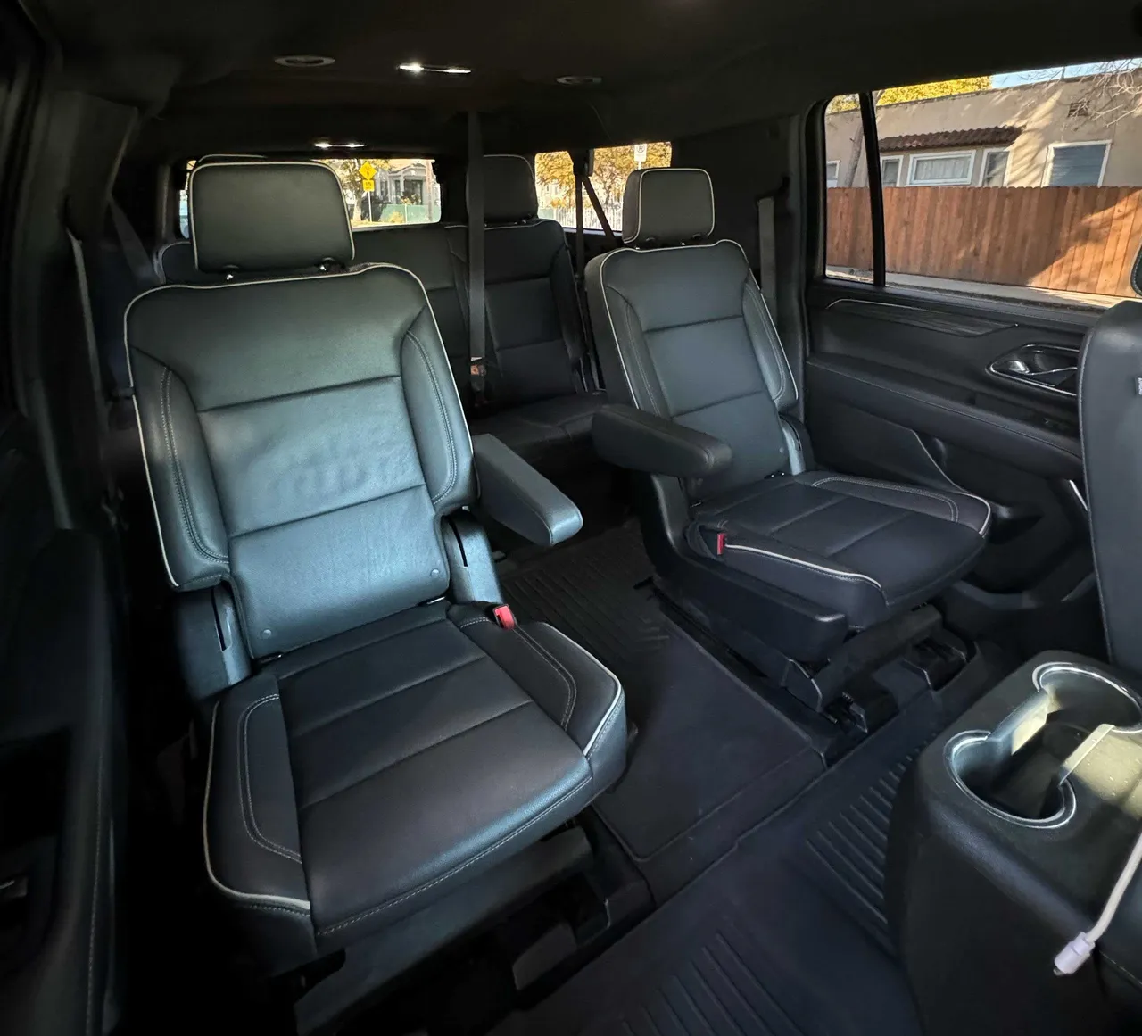 GMC Yukon XL interior with captain's chairs and cup holders for airport transfers