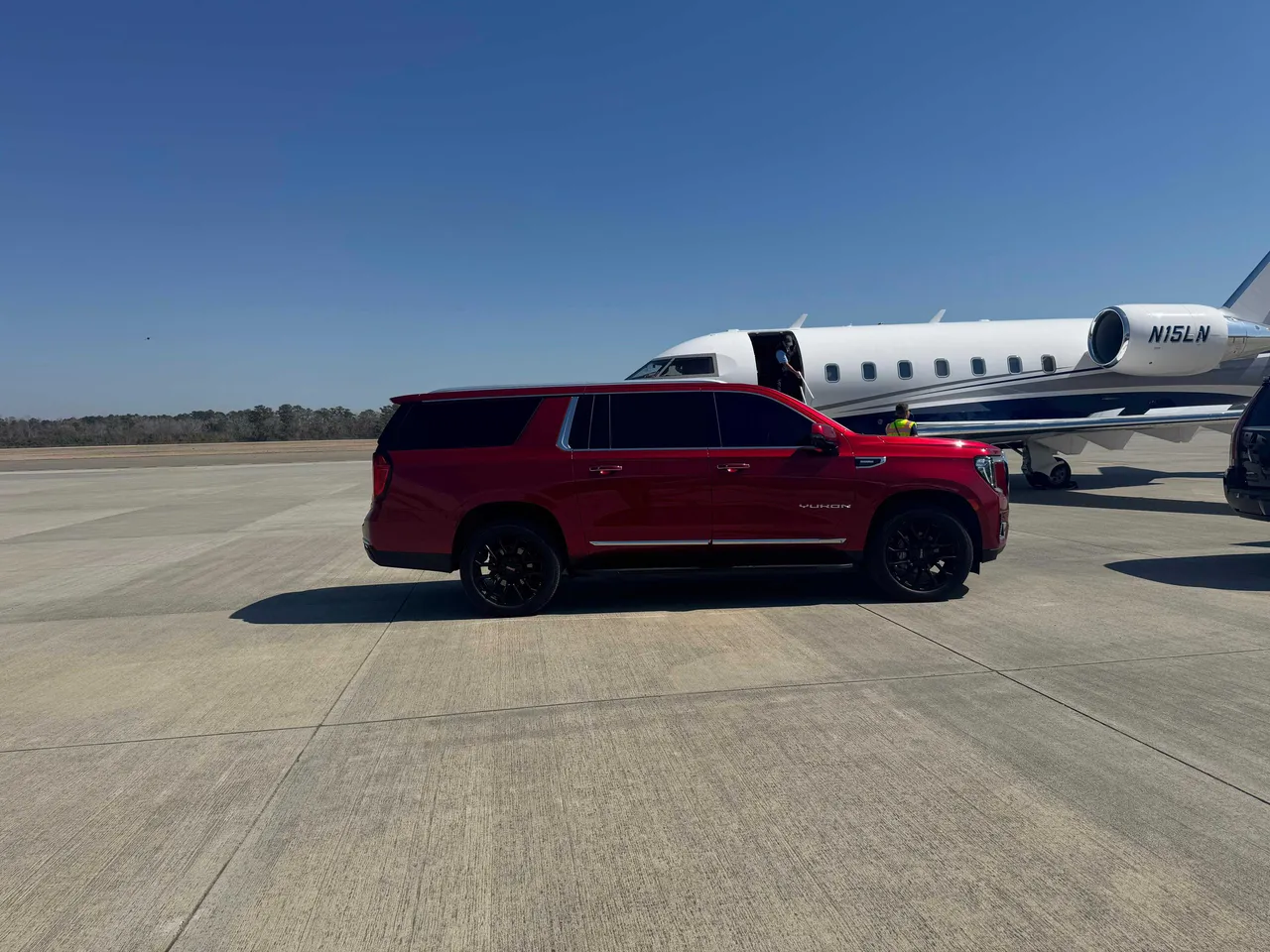 Red GMC Yukon XL for airport transfers Red GMC Yukon XL for airport transfers