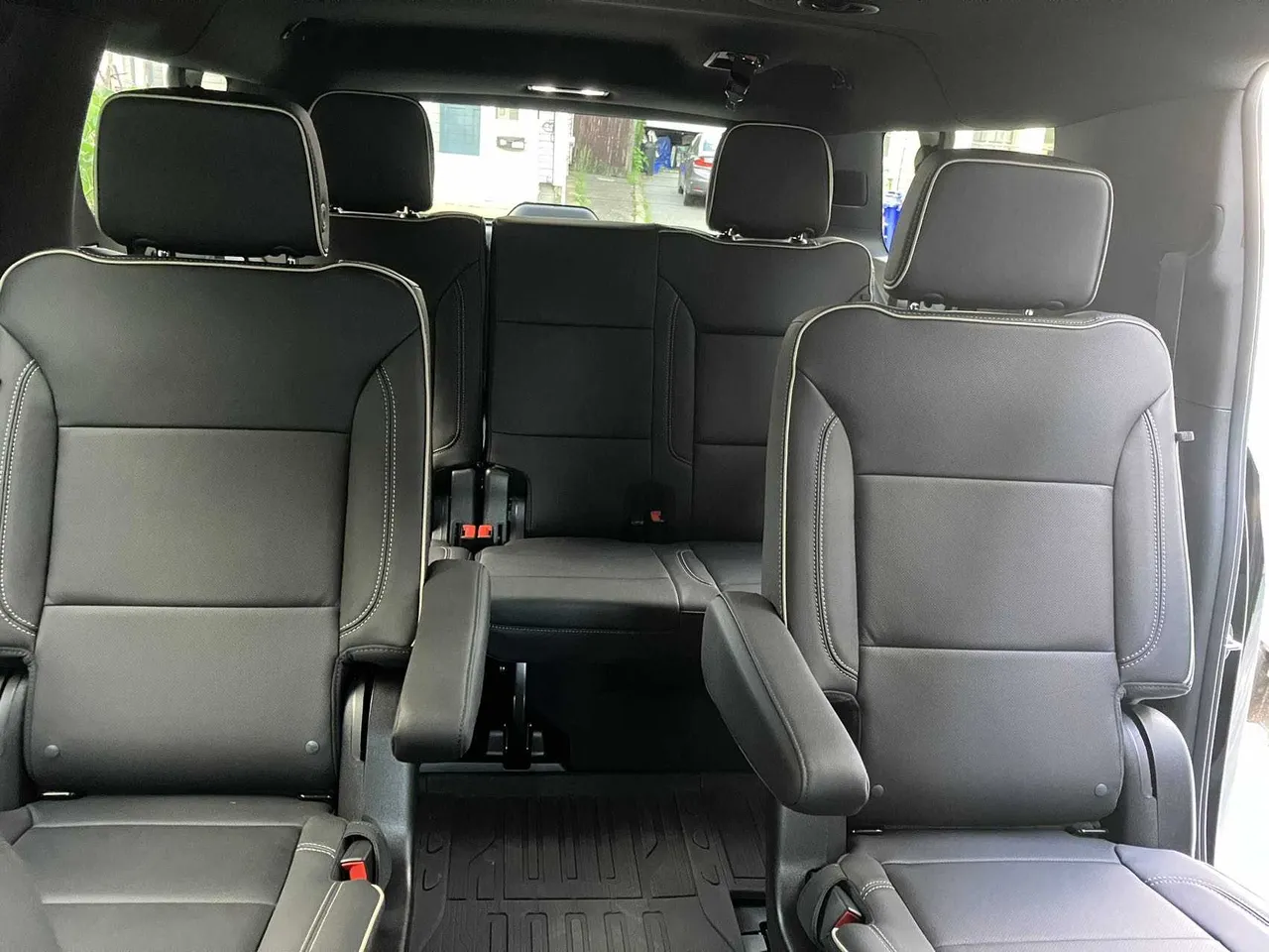 GMC Yukon XL interior with captain's chairs for airport transfers