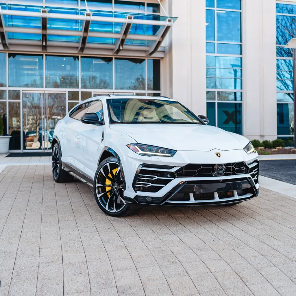 White Lamborghini Urus Omnino Albus for airport transfers