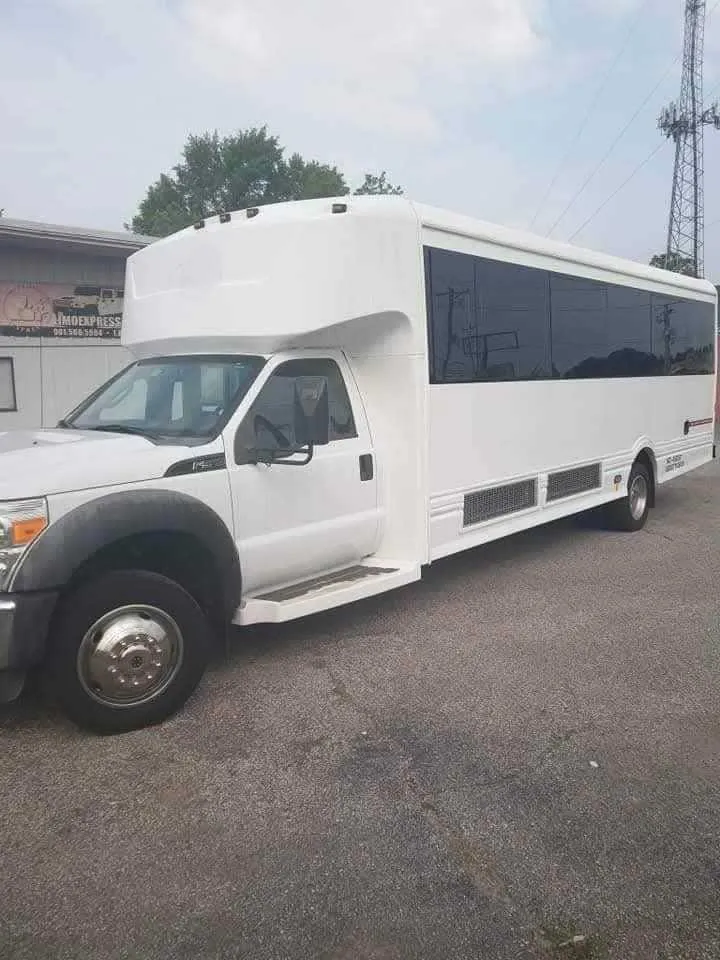 Silver 32 Passenger Limo Bus exterior with tinted windows, photo 6 for party bus rental in Northboro, IA