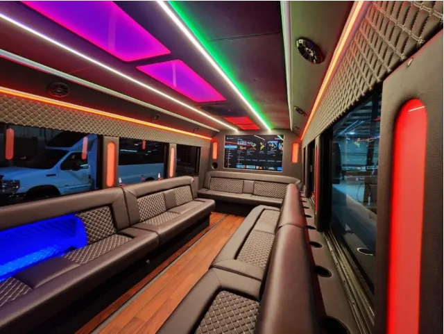 Limousine Bus interior with perimeter lounge seating, LED accent lighting and LED ceiling lighting for prom car rental in Kenner, LA Limousine Bus interior with perimeter lounge seating, LED accent lighting and LED ceiling lighting for prom car rental in Kenner, LA