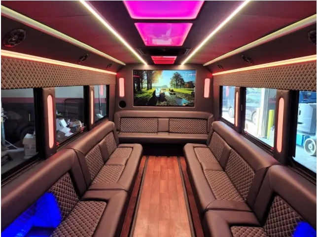 Limousine Bus interior with perimeter lounge seating, LED accent lighting and LED ceiling lighting, photo 2 for prom car rental in Kenner, LA Limousine Bus interior with perimeter lounge seating, LED accent lighting and LED ceiling lighting, photo 2 for prom car rental in Kenner, LA