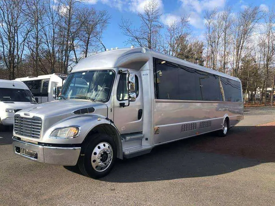 Silver Limo Bus exterior for party bus rental in Monroe City, IN