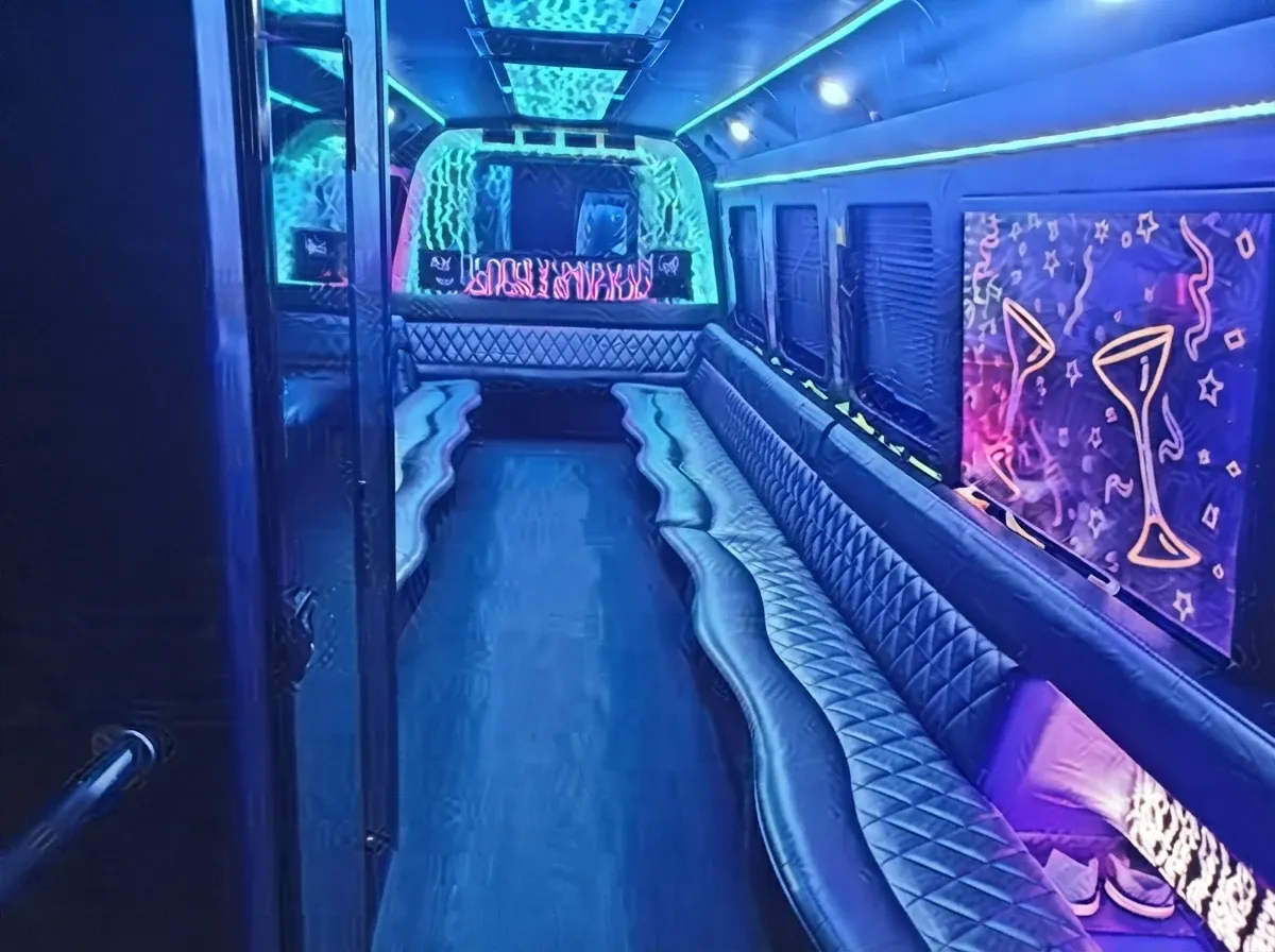 Limousine Bus interior with perimeter lounge seating, sofa-style seating and LED accent lighting for prom car rental in Rootstown, OH Limousine Bus interior with perimeter lounge seating, sofa-style seating and LED accent lighting for prom car rental in Rootstown, OH
