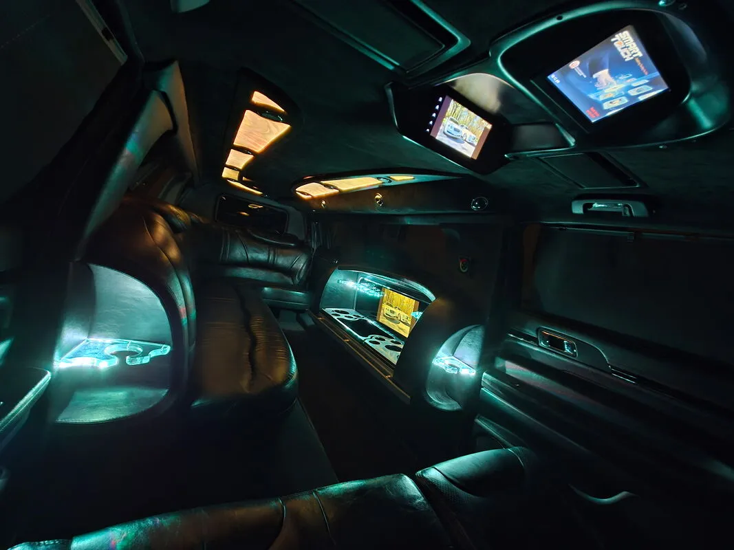 Lincoln MKT Limousine interior with LED accent lighting and TV screens, photo 6 for limo rental Lincoln MKT Limousine interior with LED accent lighting and TV screens, photo 6 for limo rental