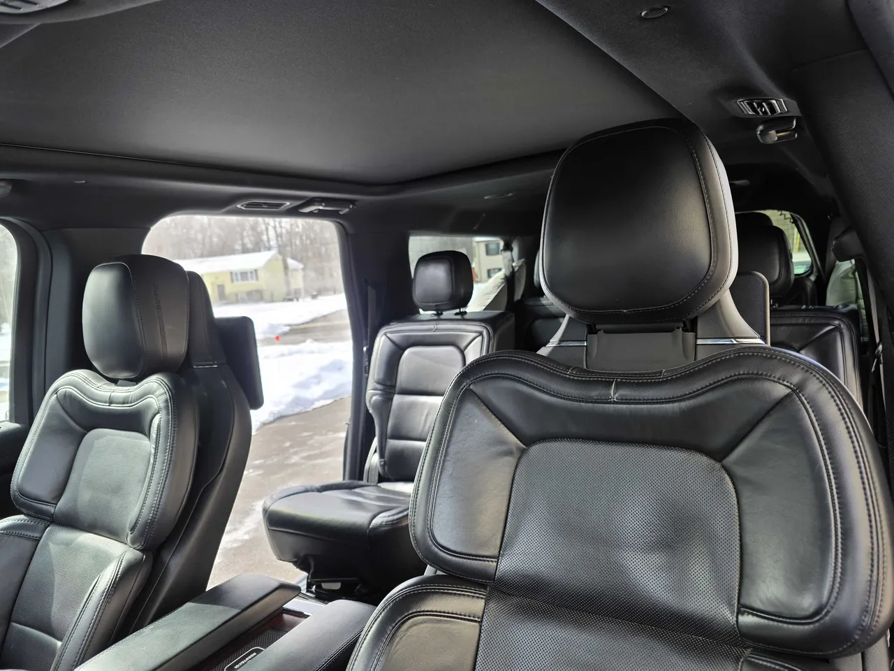 Lincoln Navigator interior with captain's chairs for airport transfers