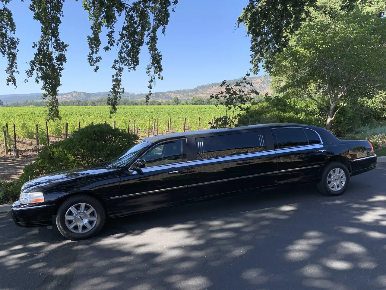 Black Lincoln stretch limousine exterior, photo 2 for cadillac escalade limo in Rio Nido, CA