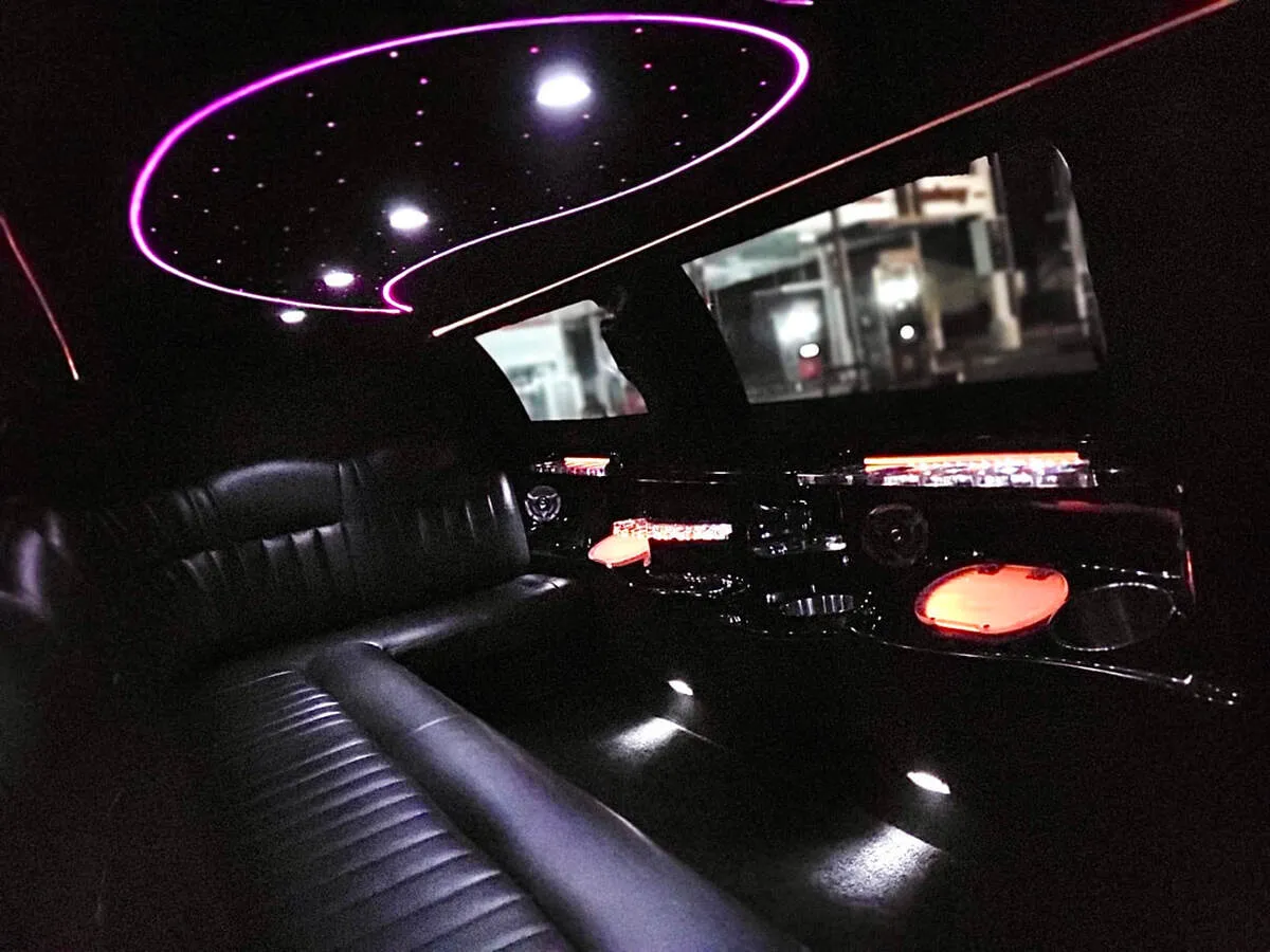 Lincoln Town Car Limousine interior with perimeter lounge seating and starlight or fiber-optic ceiling, photo 8 for prom car rental in North Attleboro, MA Lincoln Town Car Limousine interior with perimeter lounge seating and starlight or fiber-optic ceiling, photo 8 for prom car rental in North Attleboro, MA