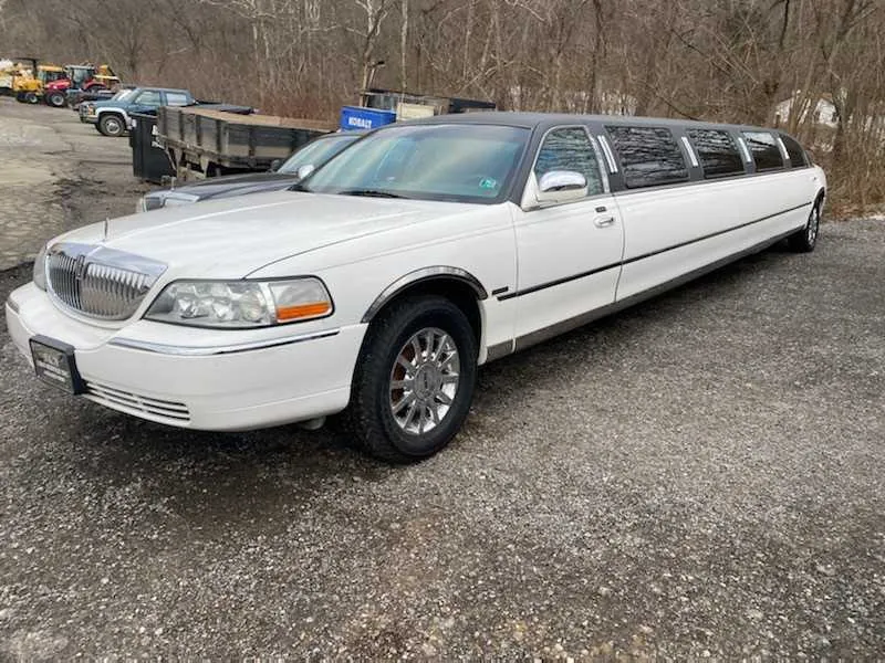 White Lincoln Town Car with tinted windows for limo rental
