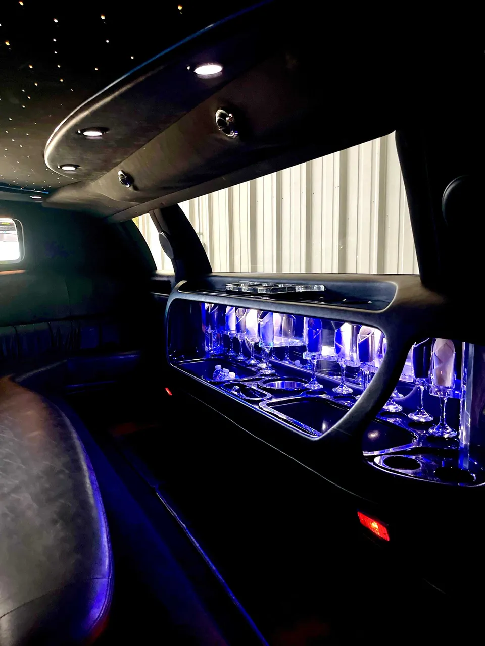Lincoln Town Car Limousine interior with LED accent lighting, starlight or fiber-optic ceiling and glassware holders for limo rental in Tuolumne County, CA