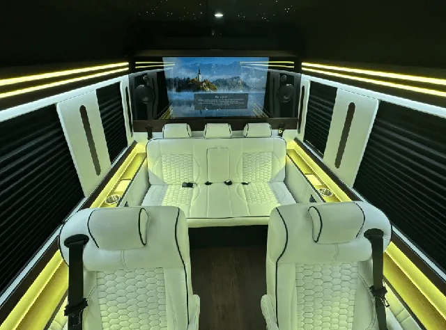 Luxury Mercedes Sprinter interior with captain's chairs, window shades and LED accent lighting for winery tour transport in New Braunfels, TX