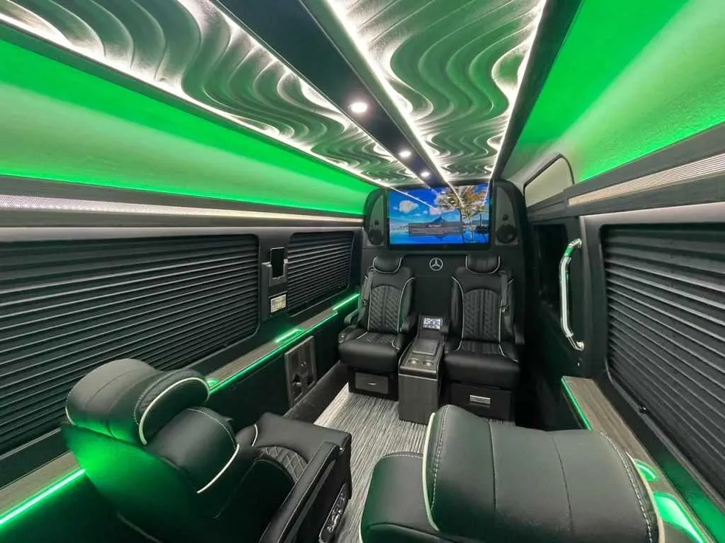 Luxury Mercedes Sprinter interior with captain's chairs, window shades and LED accent lighting, photo 6 for winery tour transport in New Braunfels, TX