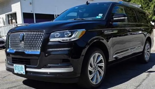 Black 6 Passenger Luxury SUV with tinted windows for airport transfers