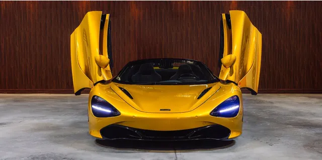 Yellow Mclaren 720s exterior with convertible roof for sports car rental