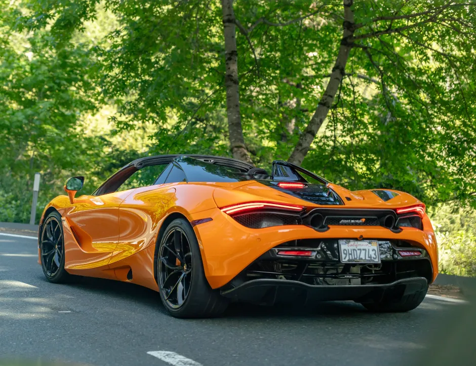 Orange McLaren 720s performance spider for exotic car rental