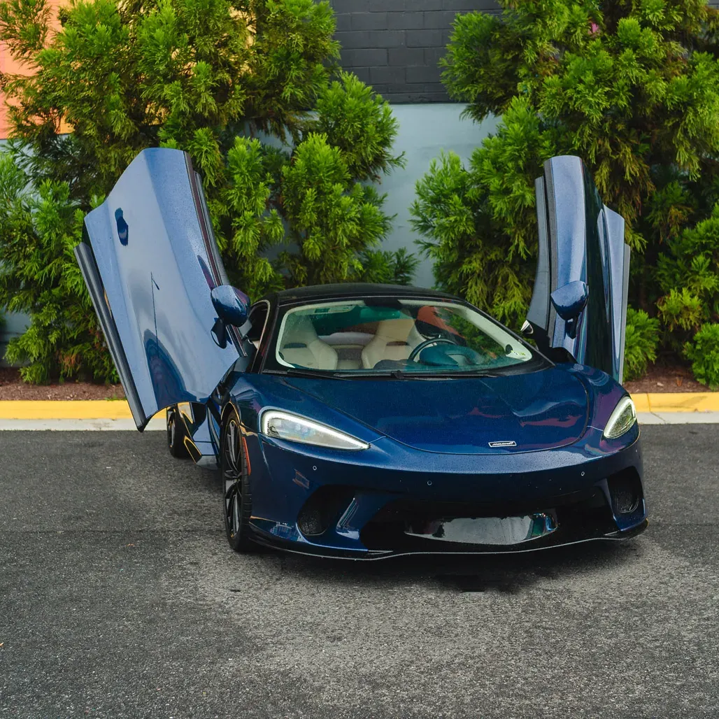 McLaren GT Aurora blue for exotic car rental