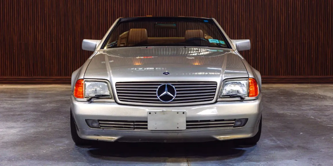 Silver Mercedes-Benz SL500 exterior with convertible roof for luxury car rental in Toms River, NJ Silver Mercedes-Benz SL500 exterior with convertible roof for luxury car rental in Toms River, NJ