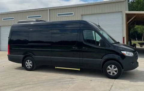 Black Mercedes-Benz Sprinter Shuttle Van for minibus rental in Sierra Blanca, TX