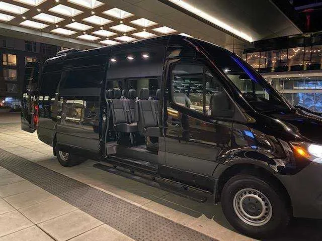 Black Mercedes Exec Sprinter with tinted windows and running boards for mercedes sprinter rental in Washington