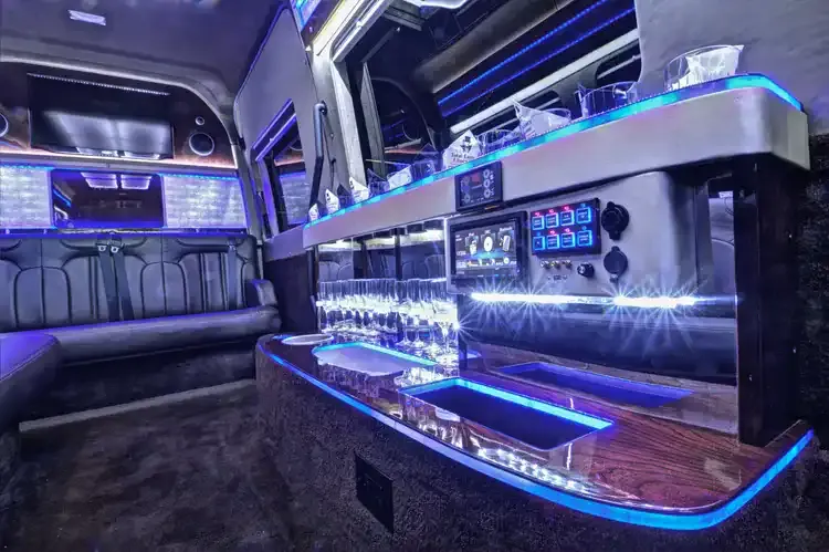 Mercedes Executive Sprinter interior with LED accent lighting, bar area and glassware holders for mercedes sprinter rental in Michigan