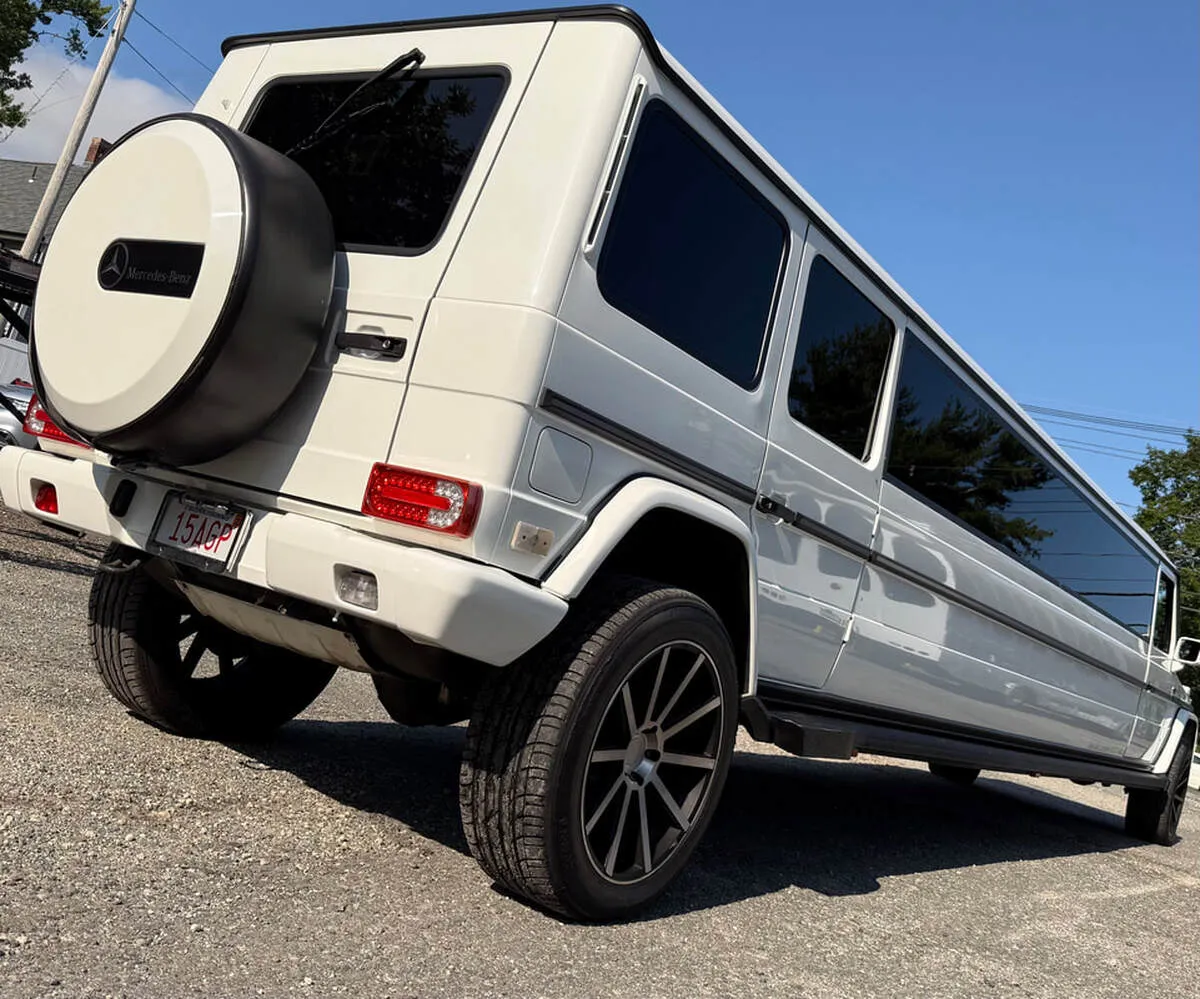 White Mercedes-Benz G Wagon exterior with tinted windows for limo rental White Mercedes-Benz G Wagon exterior with tinted windows for limo rental