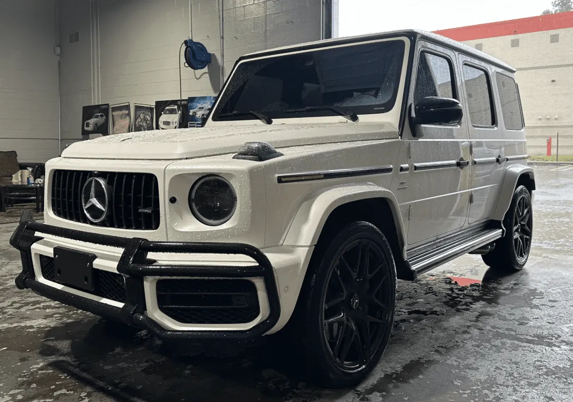 White Mercedes-Benz G Wagon with running boards for wedding car rental in Southfield, MI