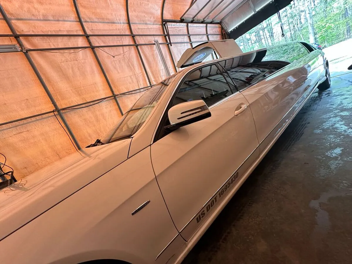 White Mercedes JET Doors Limousine exterior with tinted windows for limo rental in Oklahoma