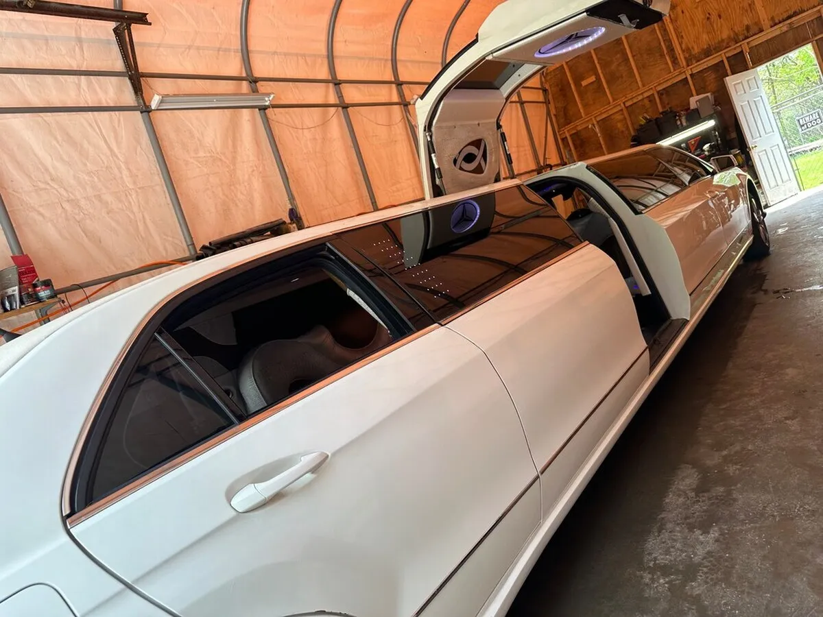 White Mercedes JET Doors Limousine exterior with tinted windows and bridal (jet) door for limo rental in Oklahoma