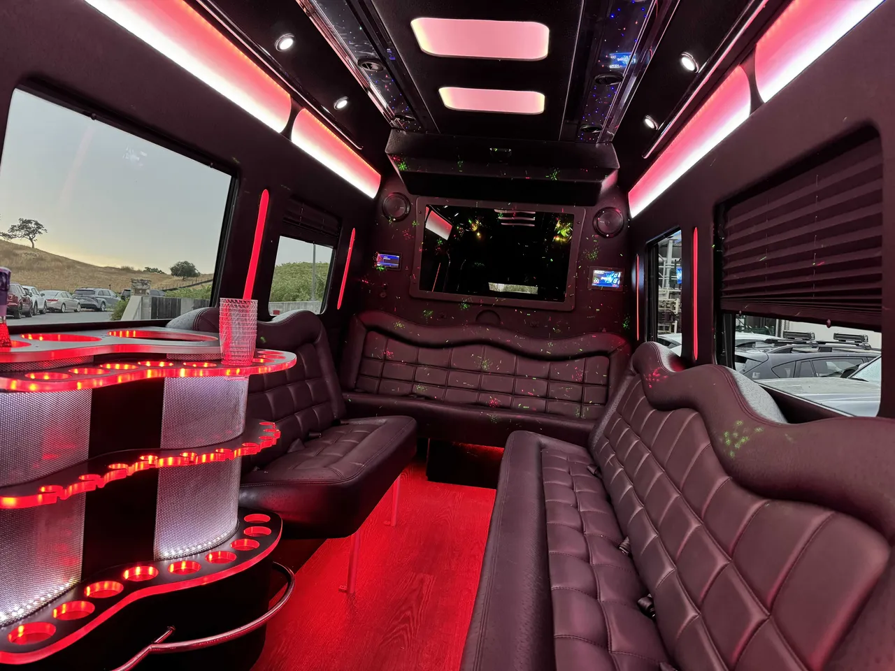 Mercedes Party Bus interior with perimeter lounge seating, window shades and LED accent lighting, photo 6 for bachelorette party transport in Fresno County, CA