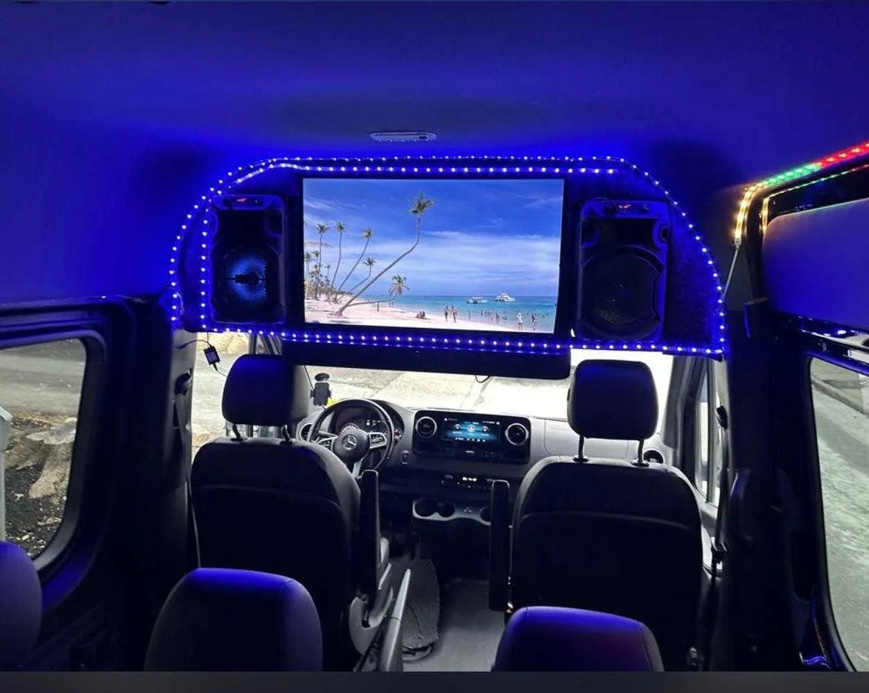 Mercedes-Benz Sprinter interior with LED accent lighting and TV screens for minibus rental Mercedes-Benz Sprinter interior with LED accent lighting and TV screens for minibus rental
