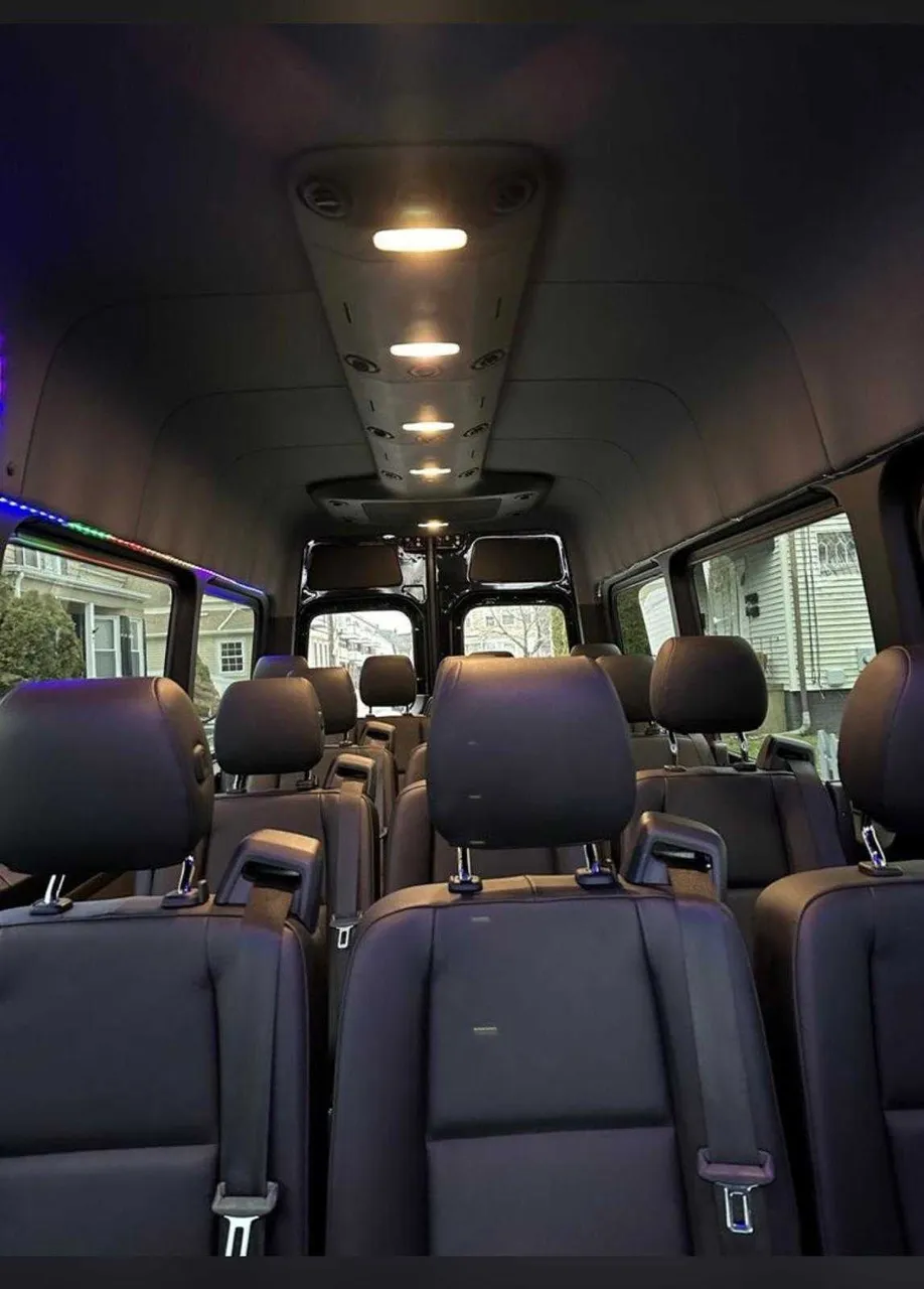 Mercedes-Benz Sprinter interior with LED accent lighting and passenger seat belts for minibus rental Mercedes-Benz Sprinter interior with LED accent lighting and passenger seat belts for minibus rental