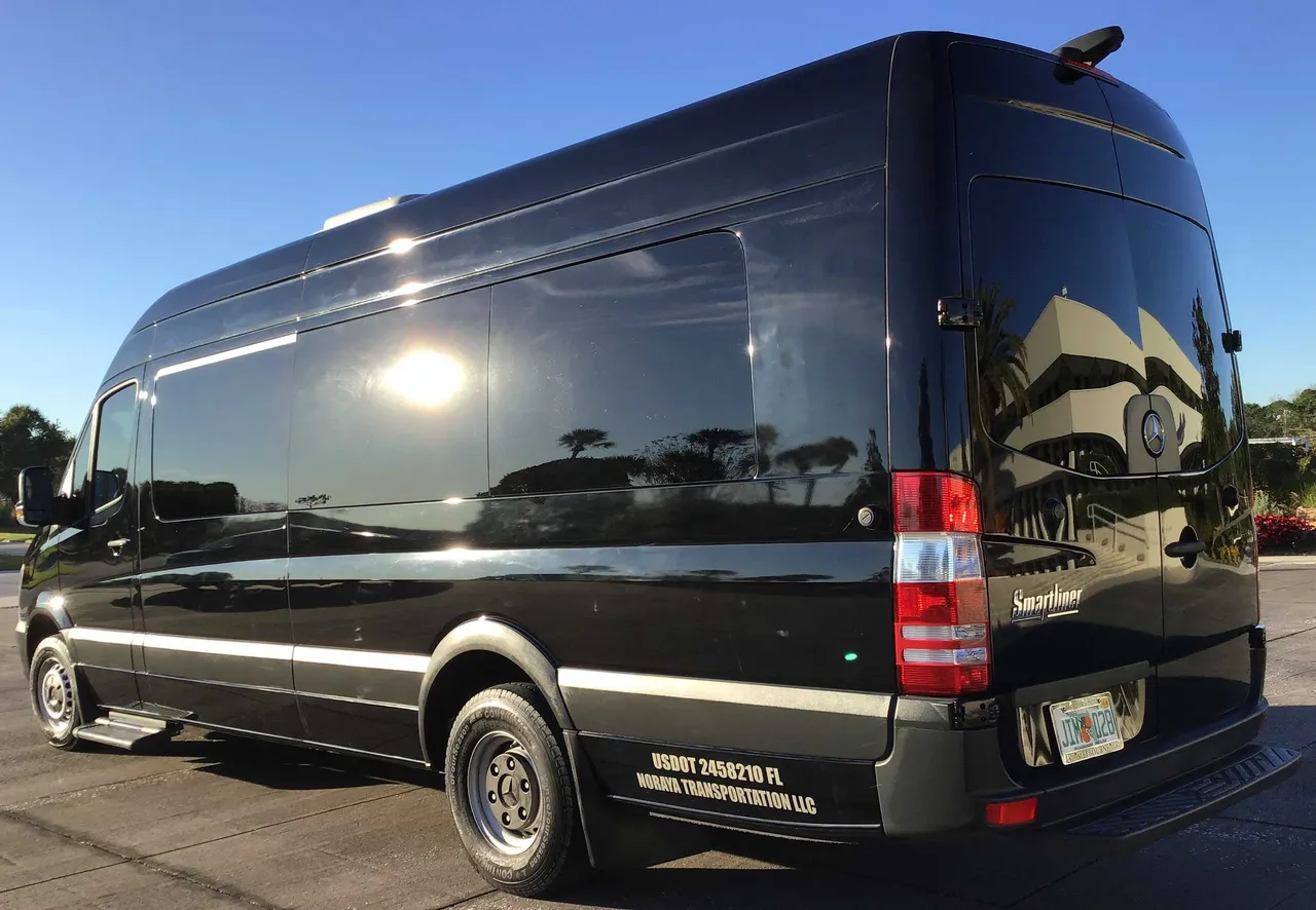 Black Mercedes Sprinter Van exterior with tinted windows and running boards for mercedes sprinter rental in Florida