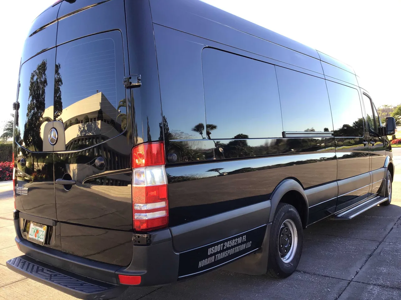 Black Mercedes Sprinter Van with tinted windows and running boards for mercedes sprinter rental in Florida