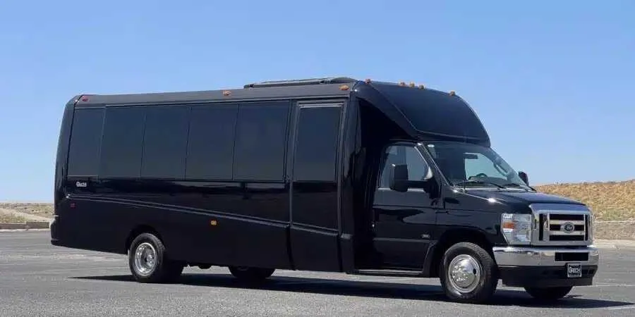 Black Mini Coach for minibus rental in Hughes Springs, TX